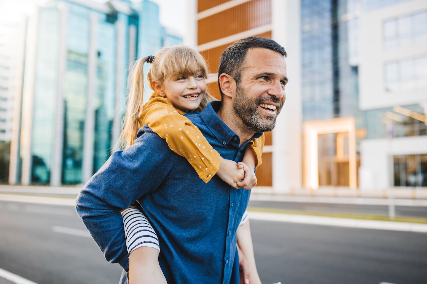 Father and daughter smiling